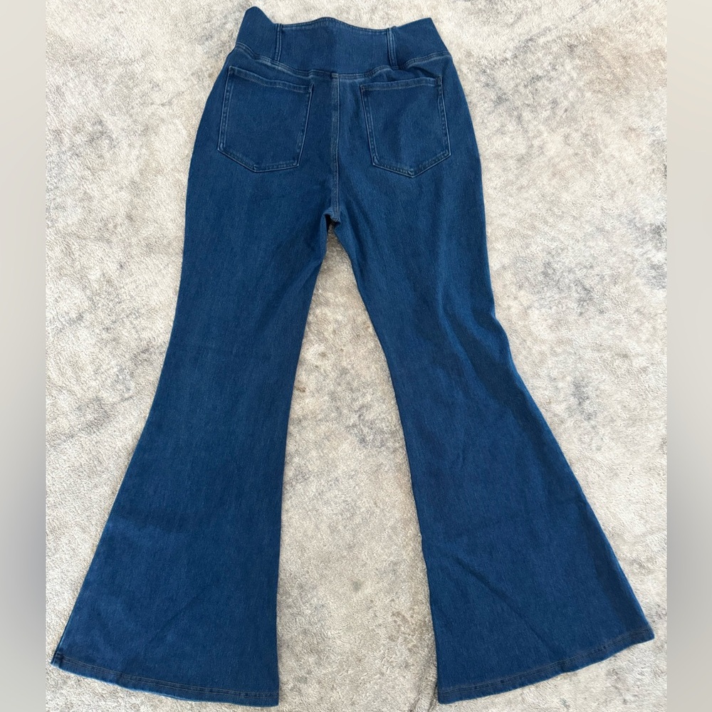 HALARA Flex High Waisted Crossover Pocket Washed Stretchy Knit Super Flare Jeans